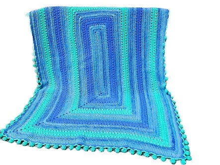 crochet baby blanket in blues and green