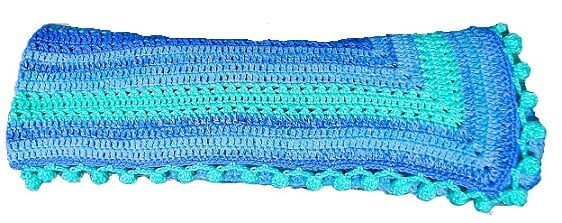 crochet blanket rolled up