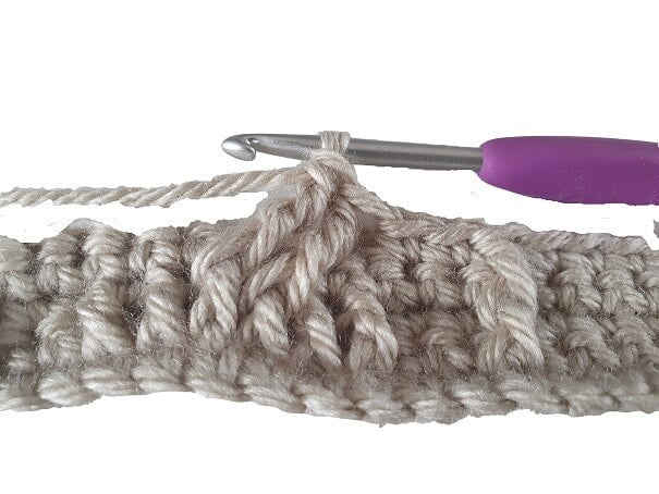 close up of a braided crochet stitch being worked