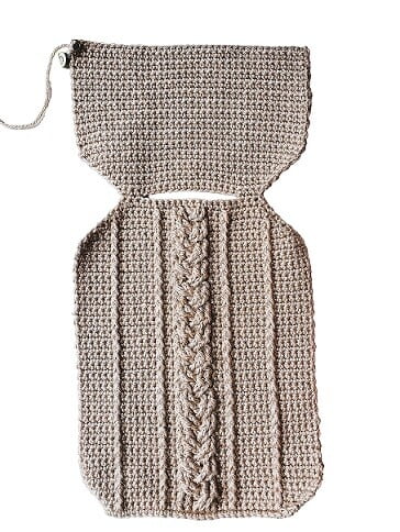 the front and upper back of a crocheted hot water bottle to show the skipped stitches at the neck