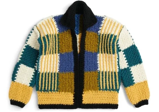 A patchwork cardigan crocheted in blues, green and brown