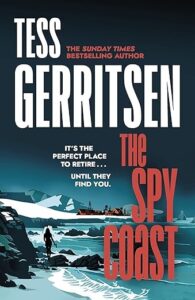 Book cover for The Spy Coast by Tess Gerritsen. A woman is walking in a frozen landscape at dusk
