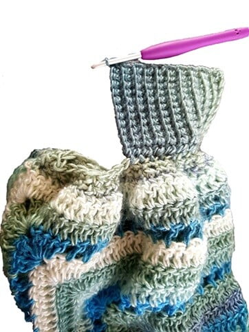 close up showing working cuffs on a hexagon cardigan