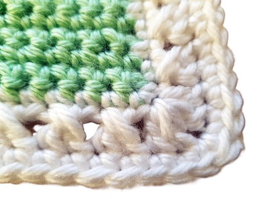 close up of a blanket border showing a crossed crochet stitch border