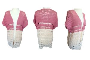 a lacy summer crochet cardigan in dusky pink and cream is styled on a mannequin showing the front, side and back view