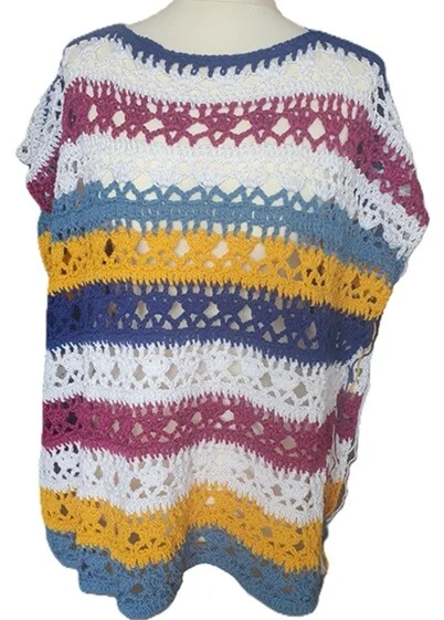 Open sided poncho styled on a mannequin