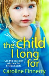 book cover for The Child I Long For by Caroline Finnerty. A young child in a blue top with a sad face dominates the cover