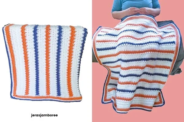 A woman is sat on a sofa with a striped blanket over her lap and feet.  The same blanket is folded and laid flat