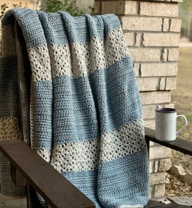 A blanket is draped over a chair