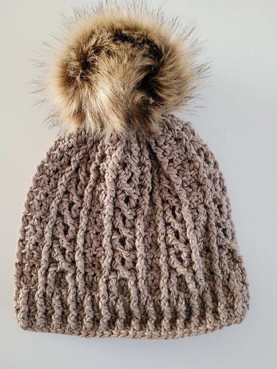 A crocheted hat that uses front post and back post stitches to create cables