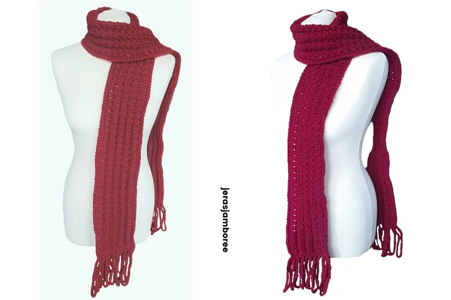 A scarf is styled on a mannequin which is draped over the shoulder leaving one end draped at the front
