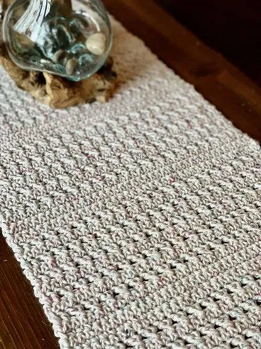 This table runner uses two different stitches to achieve the texture