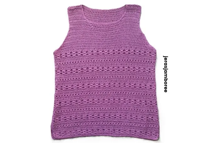 A flat-lay of the completed Ava Crochet Summer Vest in a textured, lavender-toned yarn. The vest features a sleeveless, round-neck design with alternating solid and lacy stitch rows, displayed on a white background with the text “jerasjamboree” along the right side.