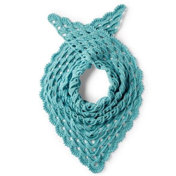 Teal crochet shawl with a scalloped edge and open shell stitch design, folded neatly in a triangle shape with the ends crossed at the top. The textured pattern creates a dimensional, lacy effect perfect for wearing as a neck scarf.