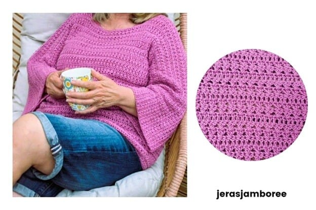 A woman relaxes in a chair wearing the Elodie Crochet Pullover in a soft pink yarn, holding a colorful mug in her lap. The sweater has a loose, comfy fit with flared sleeves and a textured stitch pattern. On the right, a circular close-up highlights the detailed crochet stitches. “jerasjamboree” appears at the bottom of the image.