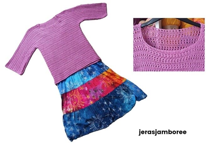 The Elodie Crochet Pullover is styled over a vibrant, multicolored skirt with sun and star patterns in shades of blue, red, and orange. The soft pink pullover features three-quarter sleeves and a textured stitch. A close-up inset highlights the neat neckline and stitch detail. The image includes the “jerasjamboree” watermark.