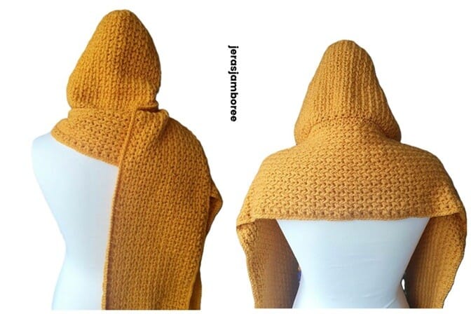 Mustard yellow crochet hooded scarf displayed on a mannequin, shown from the back with textured feather stitch design.