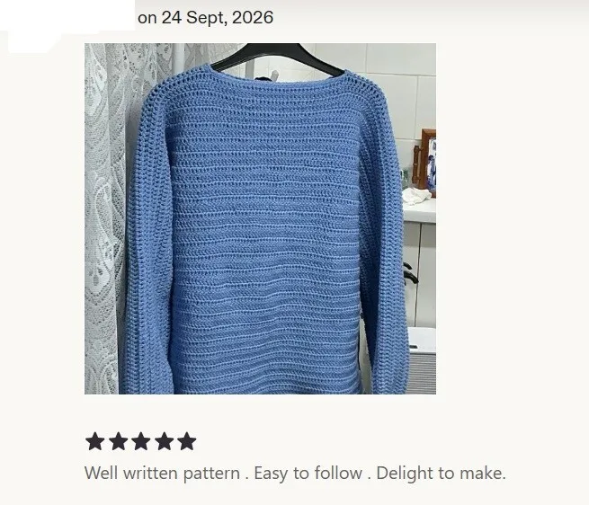 Coastal Breeze crochet sweater on a hanger in cornflower blue as part of a 5 star Etsy review.  Text reads: Well written pattern.  Easy to follow.  Delight to make.