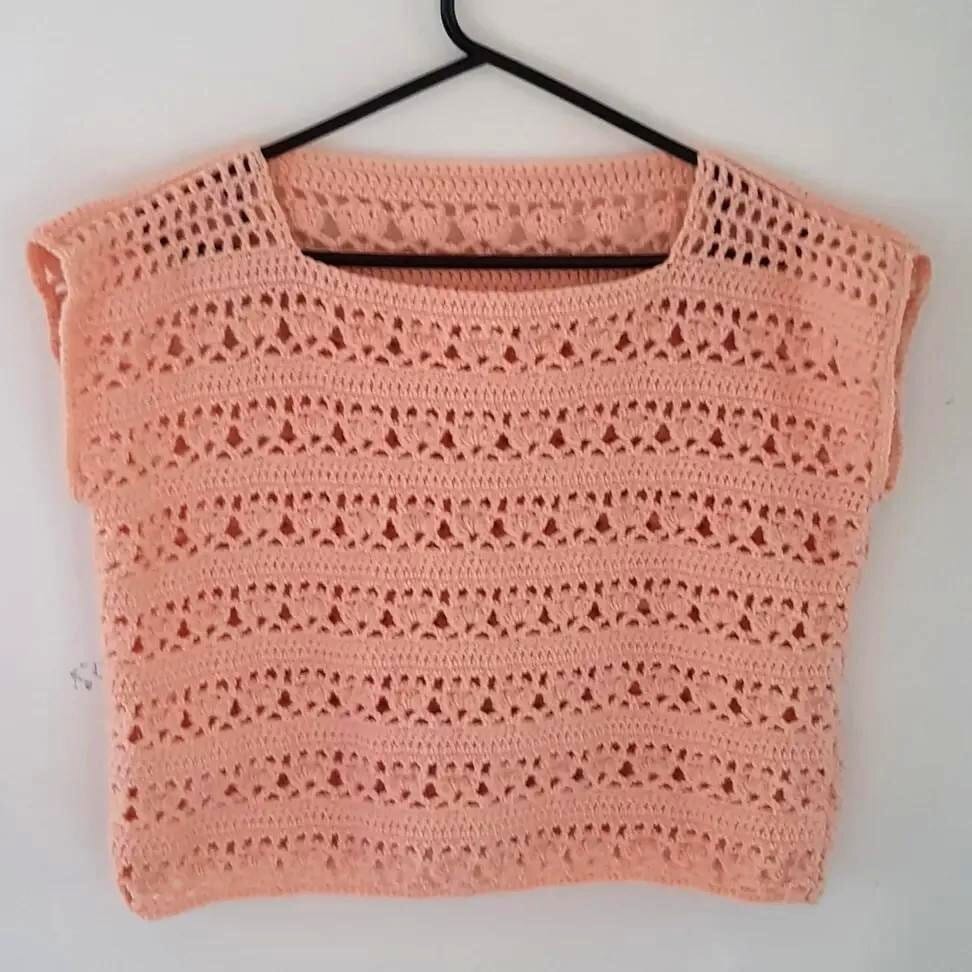 The Lily crochet summer top in the shorter version crocheted in peach 