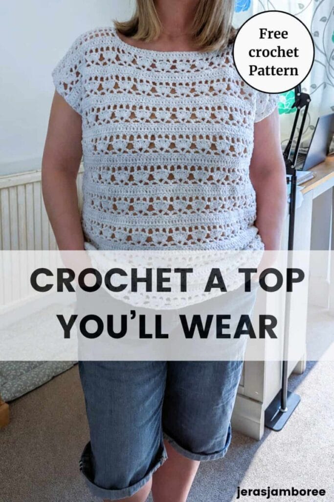Woman wearing a white crochet summer top with lace detail and short sleeves, styled casually with denim shorts, text overlay reads “Crochet a Top You’ll Wear”.