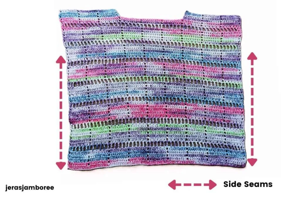 Marlowe Summer Top laid flat with arrows indicating where the front and back panels are sewn together from the armholes to the hem.