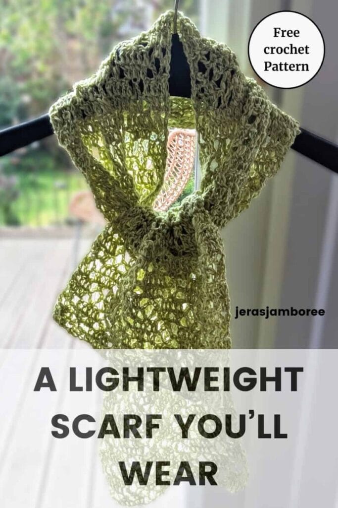 Pinterest pin featuring the Meadowsong lightweight crochet lace scarf tied loosely on a black hanger with the text overlay “A Lightweight Scarf You’ll Wear” and “Free Crochet Pattern.”