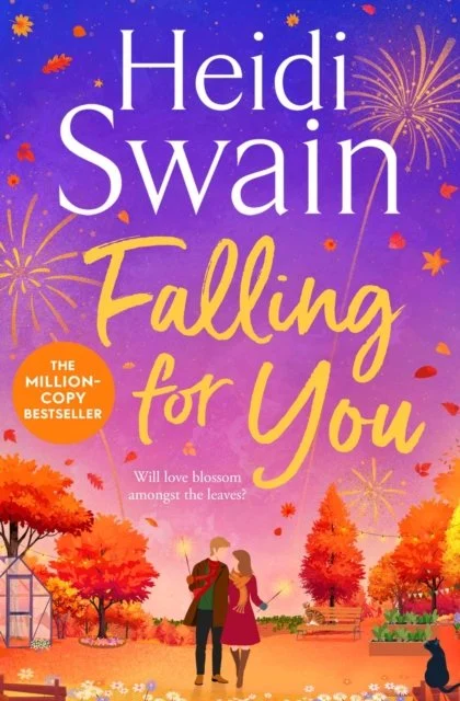 Book cover of Falling For You by Heidi Swain, featuring a couple walking together through an autumn park, surrounded by colourful trees and falling leaves beneath a purple sunset sky.